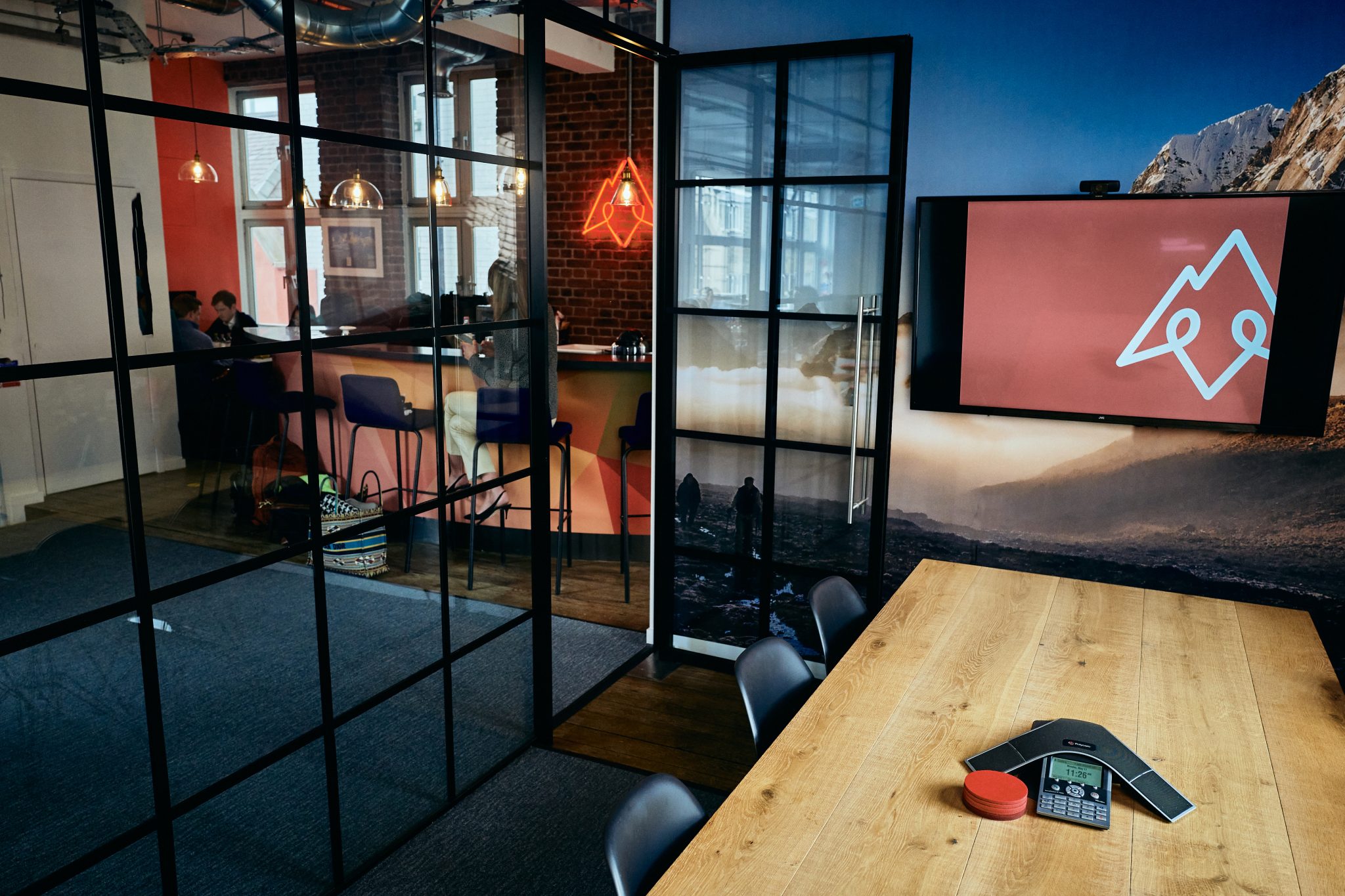 Tenzing branded office environment showcasing the private equity brands visual identity in a workplace setting.
