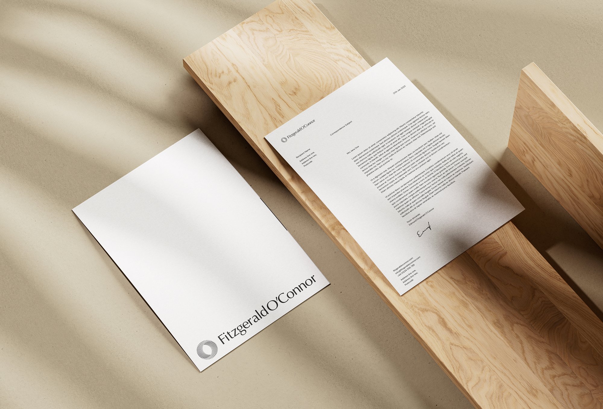 Flat lay of branded stationery with the Fitzgerald O’Connor logo, demonstrating premium reconstructive plastic surgery branding.